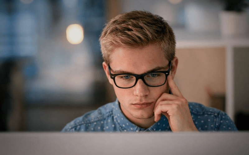 Job seeker using best AI resume optimization tools on laptop showing analysis metrics, keyword suggestions, and structural improvements for 2026 job applications