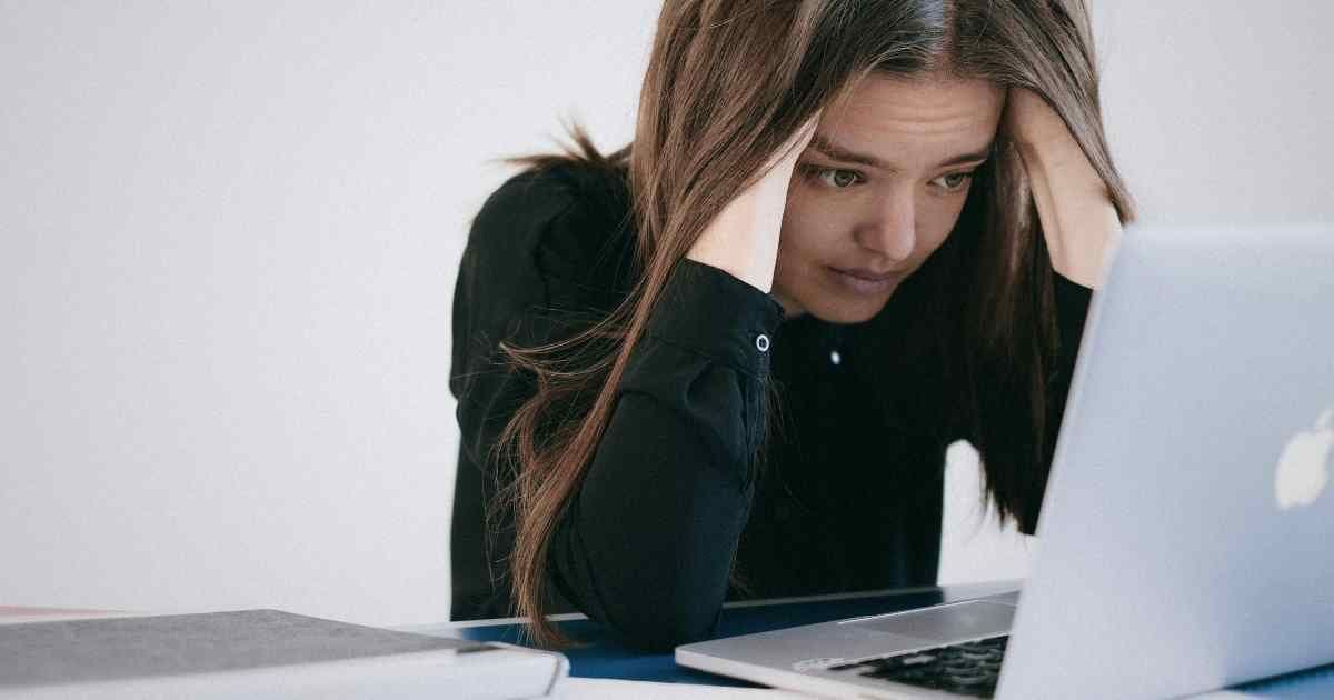 Job seeker reviewing financial documents and planning next steps after layoff