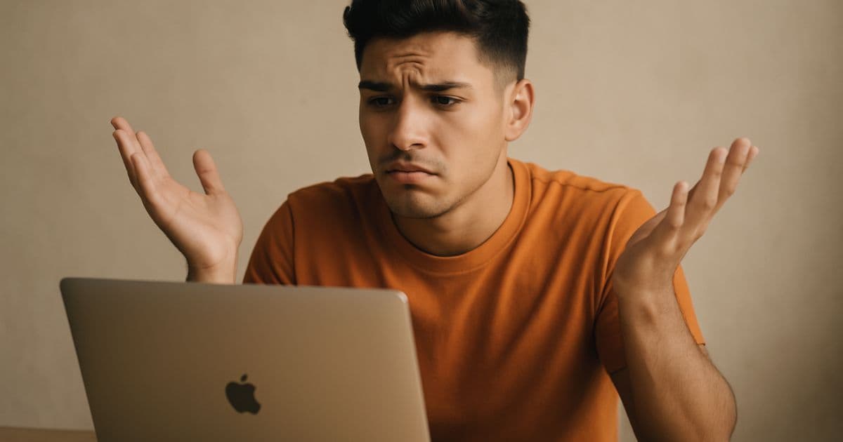 Job seeker reviewing resume on laptop at desk, analyzing application materials to improve interview callback rate