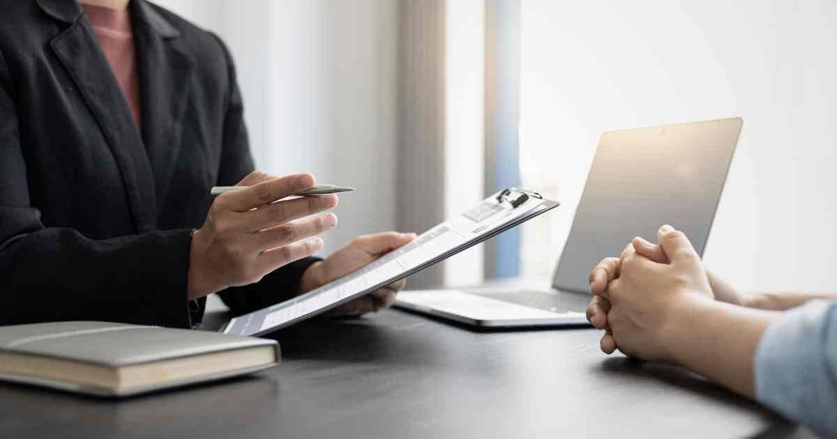 hr-person-talking-to-laid-off-worker-about-resume-upskilling-refresh