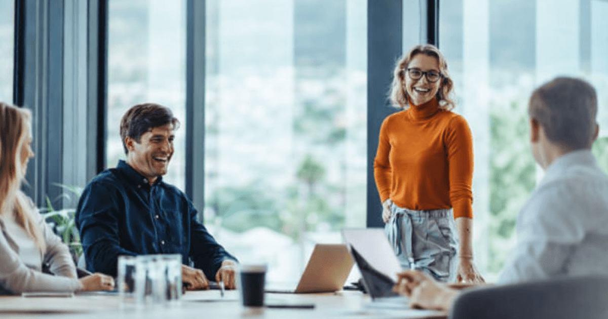 HR leaders reviewing outplacement services documentation in a modern corporate meeting room during workforce transition planning