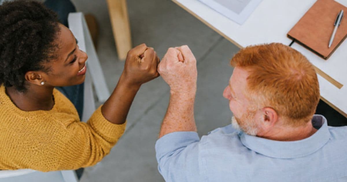 career-center-member-fist-bumb-after-happy-with-gatsby-benchmarks