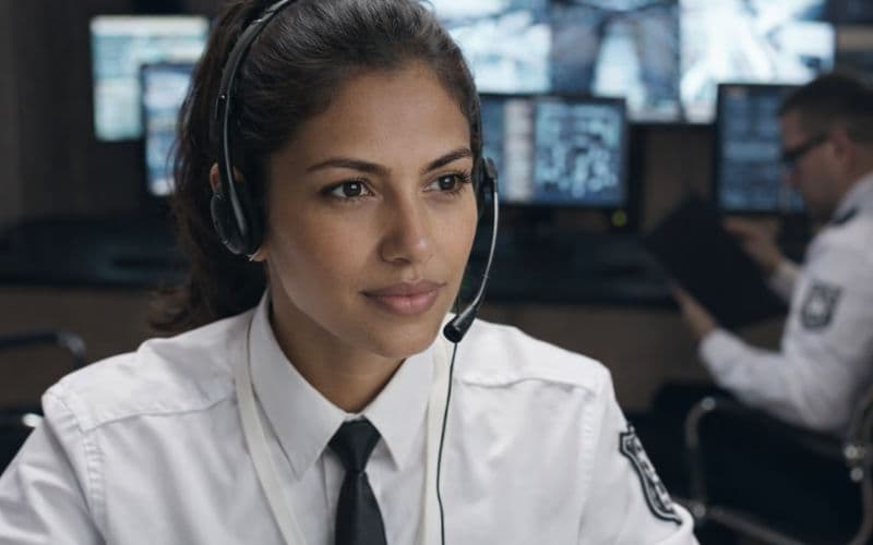 911 operator working in an emergency communications center, representing a professional resume example for public safety dispatch and emergency call handling roles