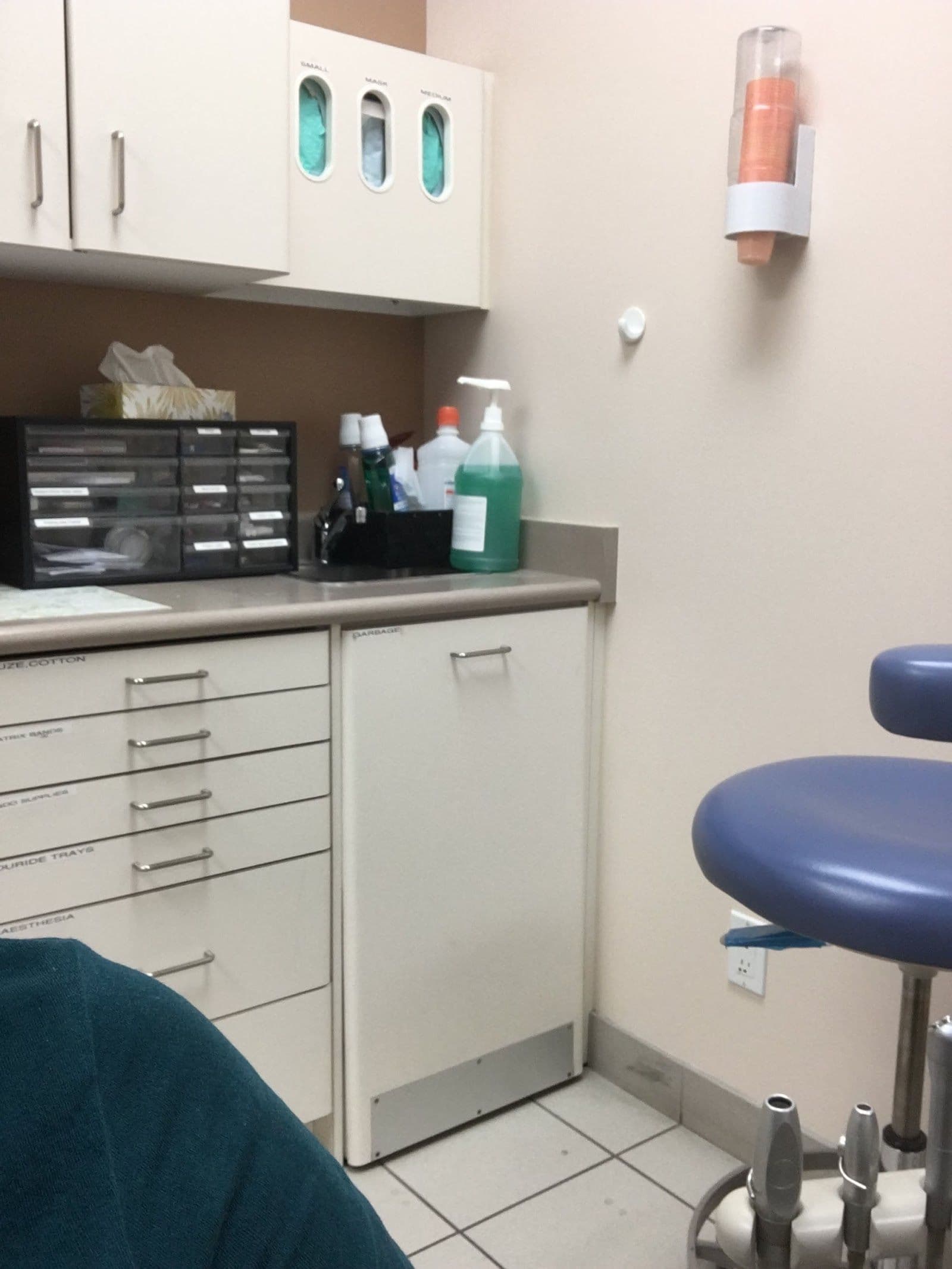 Dental clinic front desk team reviewing patient feedback together on a tablet inside the practice
