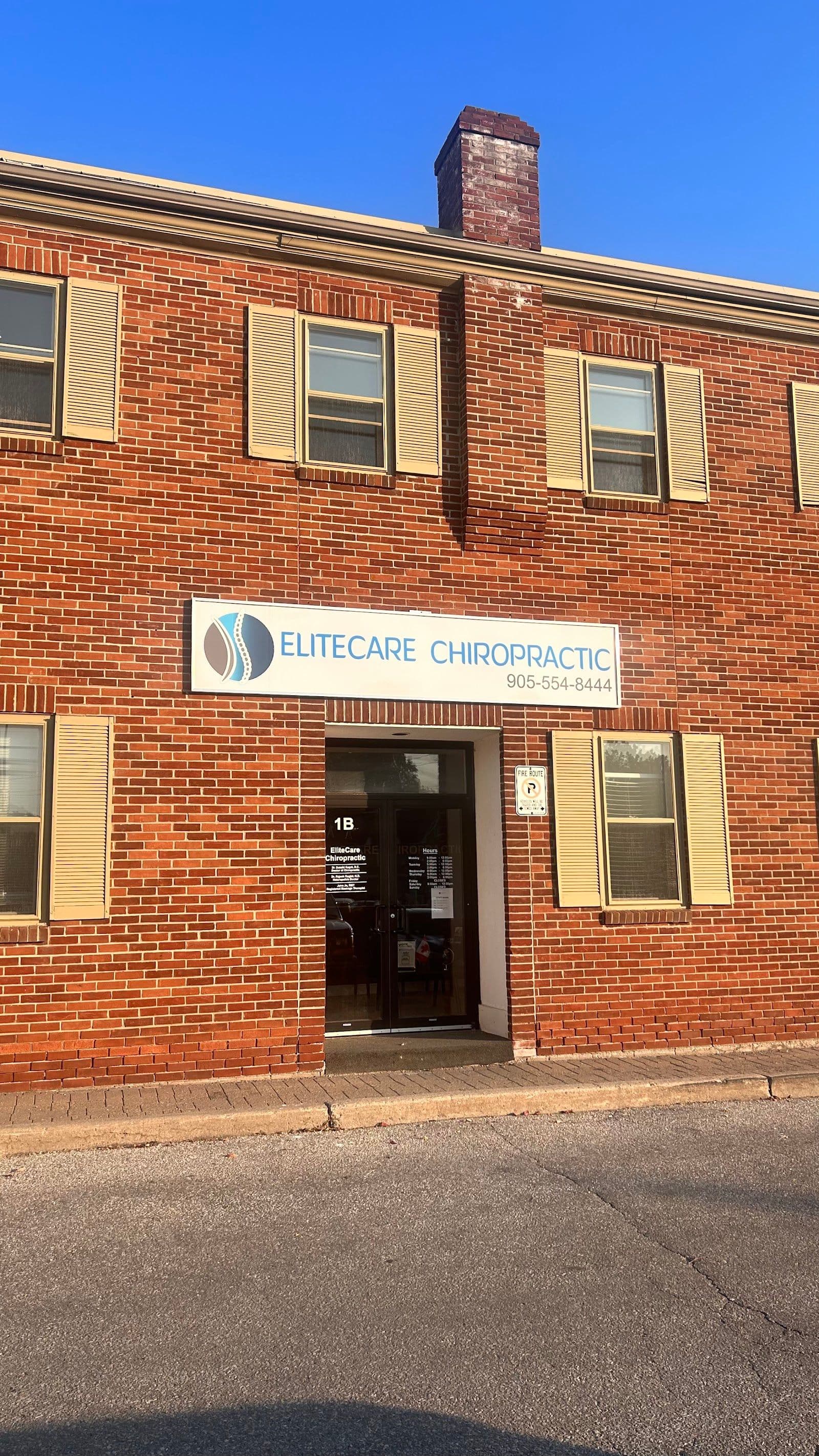 A chiropractic clinic team reviewing patient feedback and Google reviews together at the front desk
