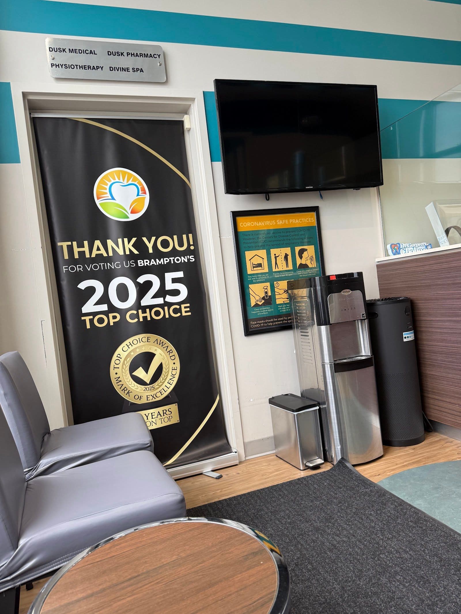 Dental clinic front desk team reviewing patient feedback together on a tablet in a clean, bright reception area