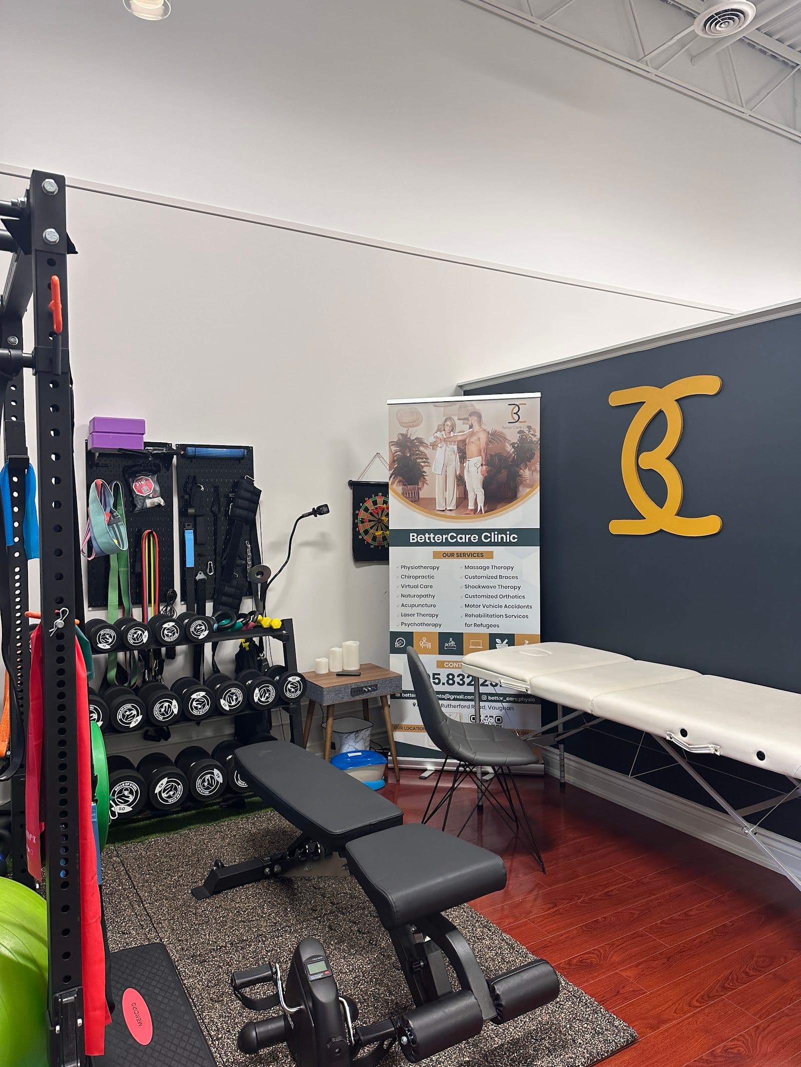 Physiotherapy clinic team reviewing patient feedback together at the front desk, with appointment notes visible on a tablet screen