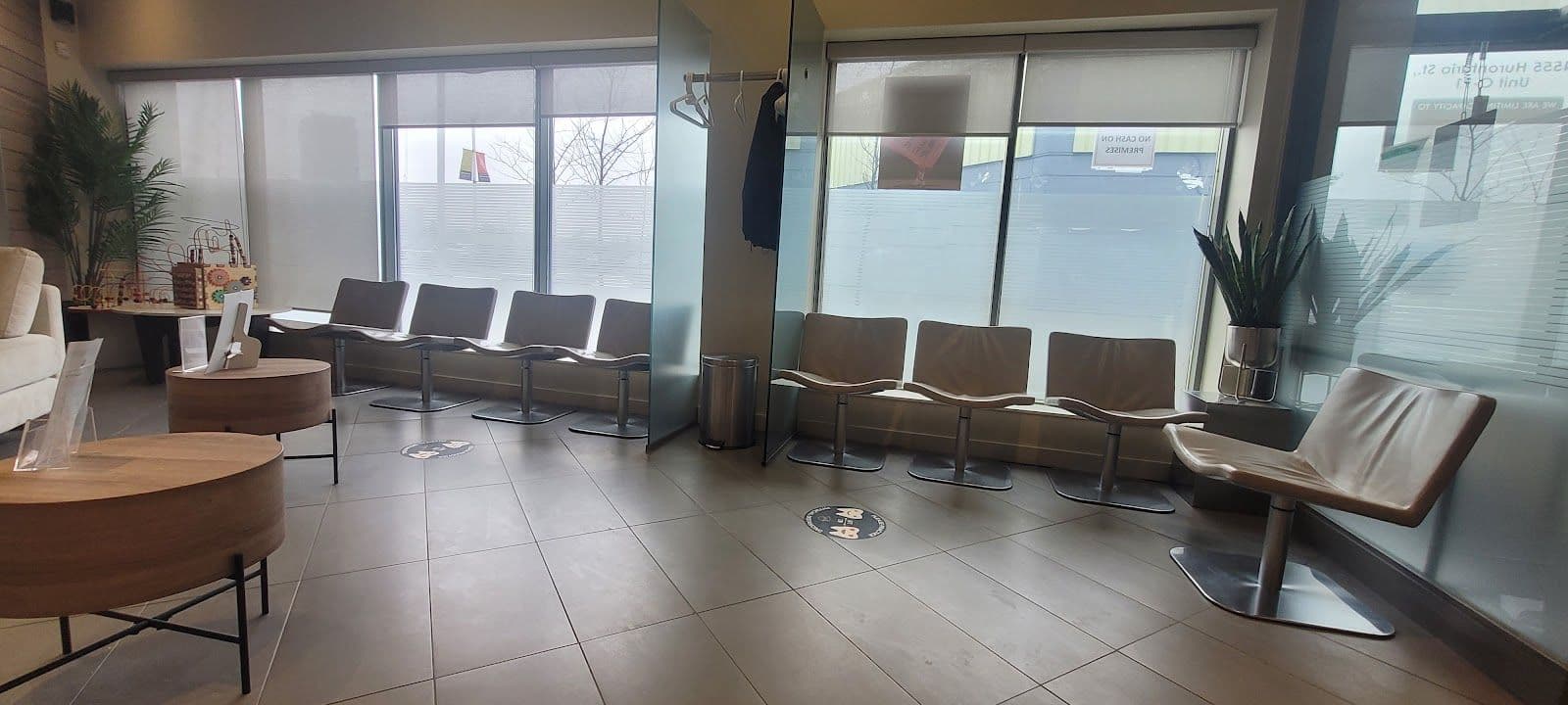 Dental clinic front desk team and practice manager reviewing patient feedback together on a tablet at the reception area